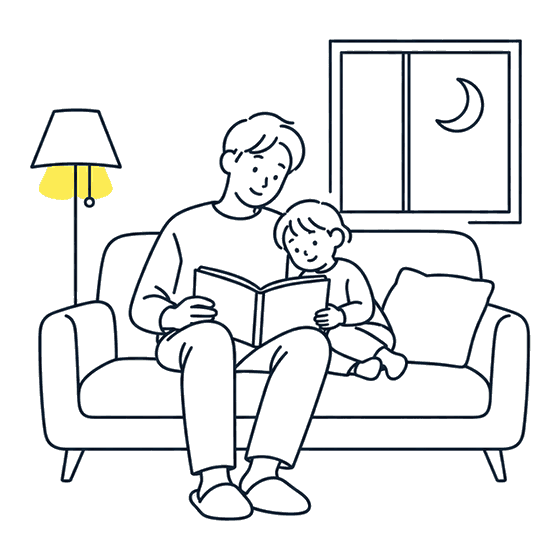 ソファで子どもと絵本を読む父親